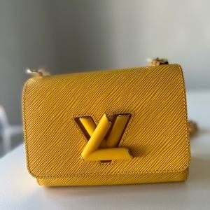Louis Vuitton Twist in yellow with gold hardware.